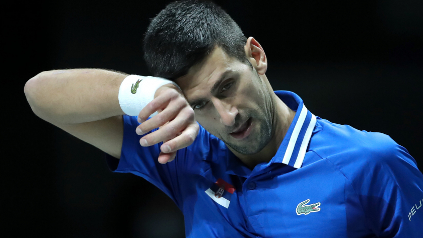 MADRID, SPAIN - DECEMBER 03: Novak Djokovic of Serbia  wipes away sweat during the Davis Cup Semi Final match between Croatia and Serbia at Madrid Arena on December 03, 2021 in Madrid, Spain. (Photo by Sanjin Strukic/Pixsell/MB Media/Getty Images)