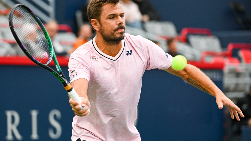 FILE PHOTO: Aug 8, 2022; Montreal, Quebec, Canada; Stan Wawrinka (SUI) hits a shot against Emil Ruusuvuori (FIN) (not pictured) during first round play at IGA Stadium. David Kirouac-USA TODAY Sports
